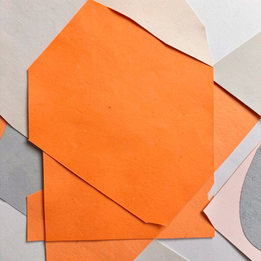 A paper cut-out collage of a durian fruit in warm amber and brown layered shapes against a dark background